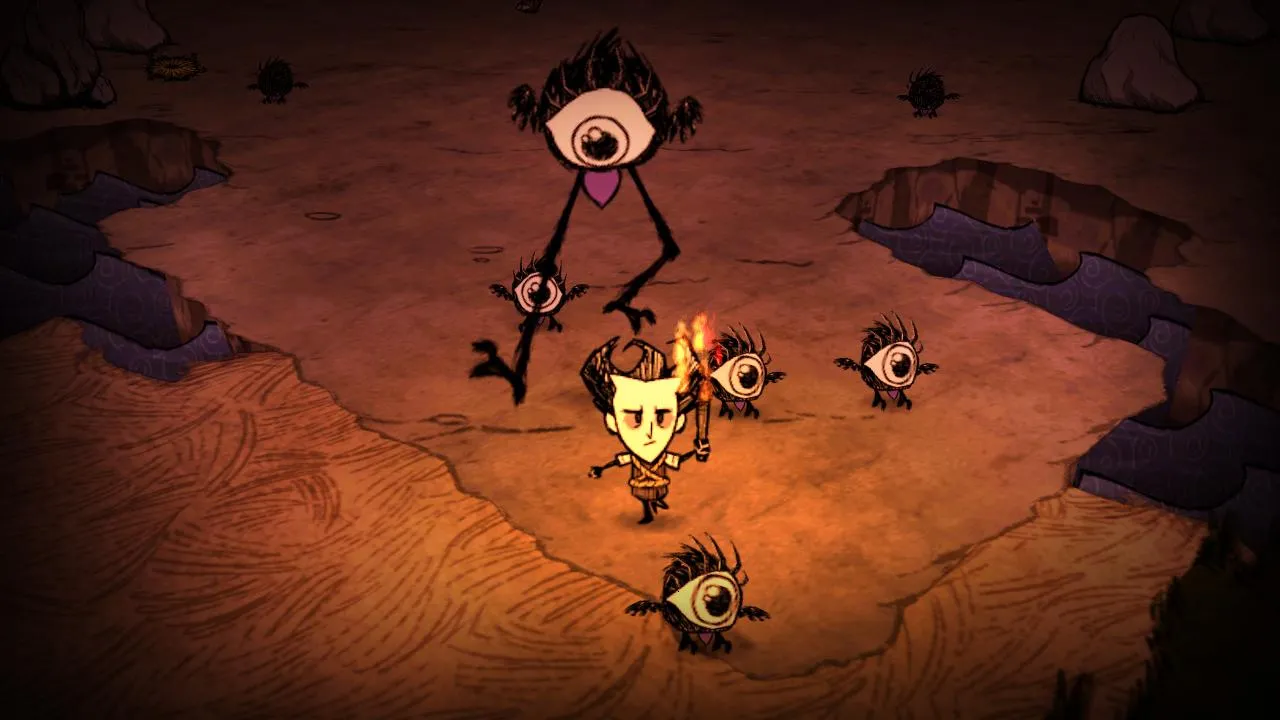 alt: A screenshot from Don't Starve showing the character fighting a spider.