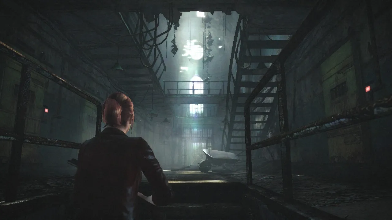 alt: Claire and Moira explore a dark and dilapidated prison in Resident Evil Revelations 2 Episode 1.