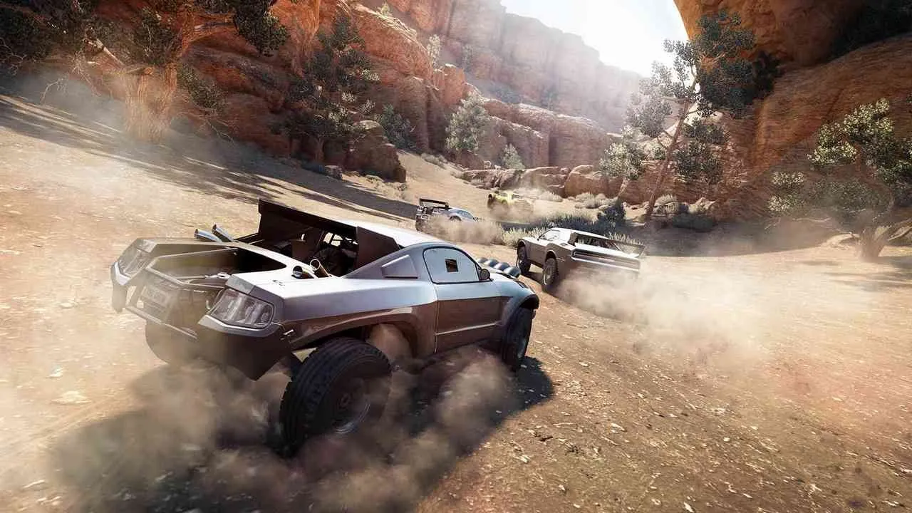 alt: Screenshot of The Crew showing a car driving through a desert environment, highlighting the vastness of the game world