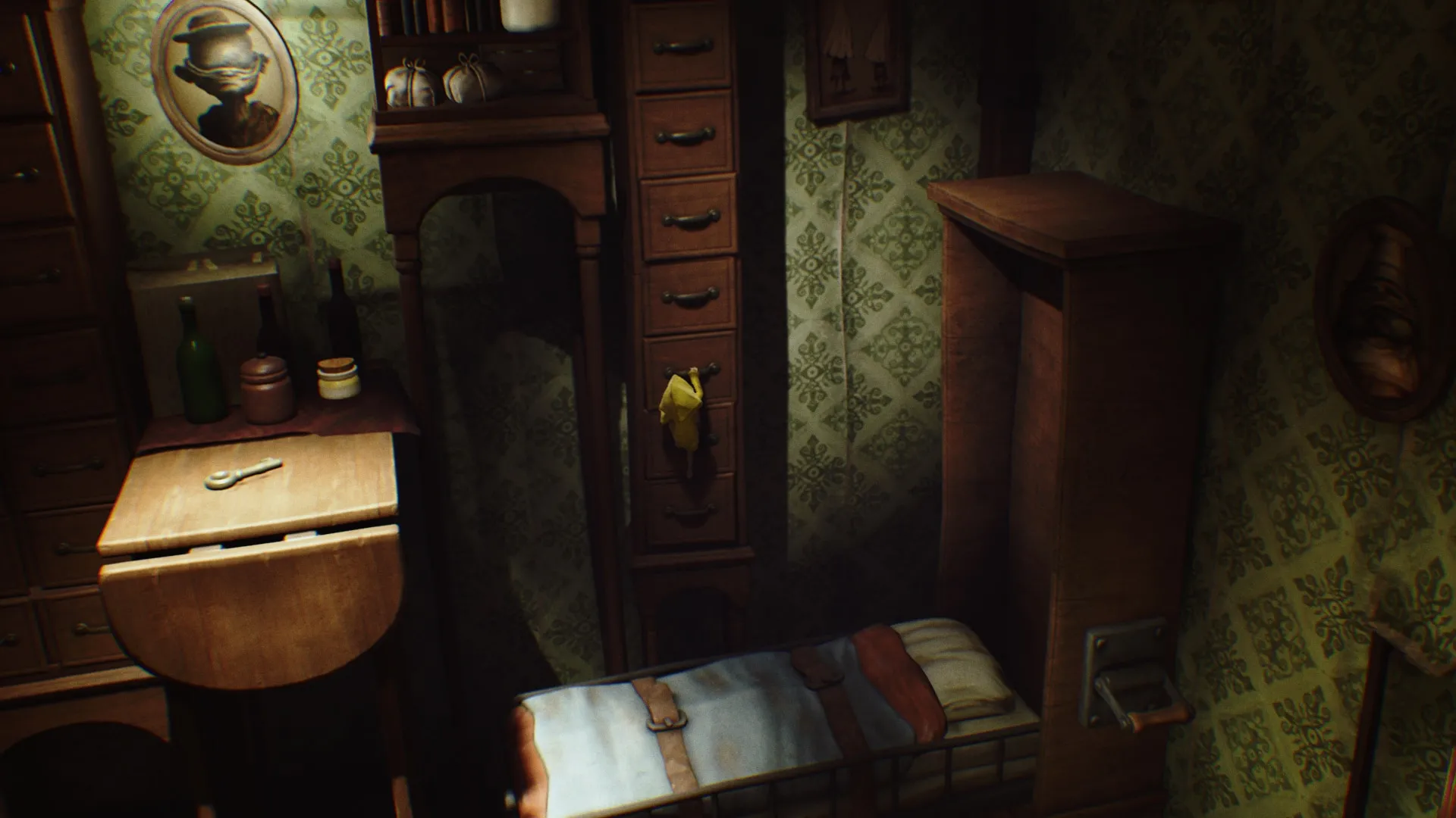 alt: Six navigating the dark and creepy depths of The Maw in Little Nightmares