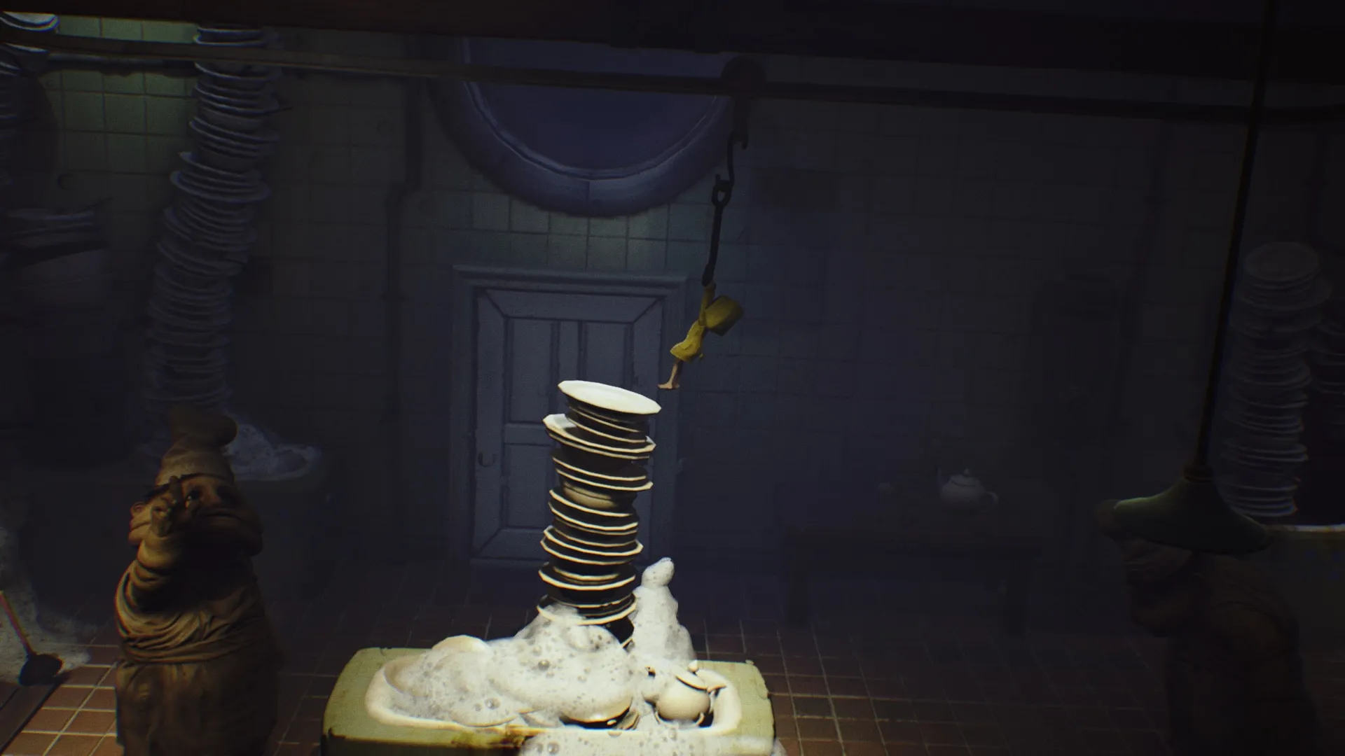 alt: Six observing the grotesque environment in Little Nightmares