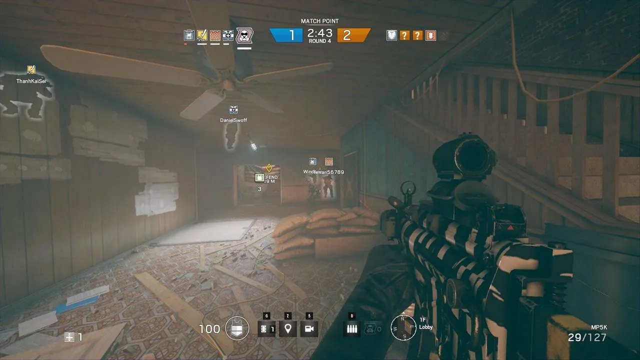 alt text: Attackers breaching a fortified position in Rainbow Six Siege