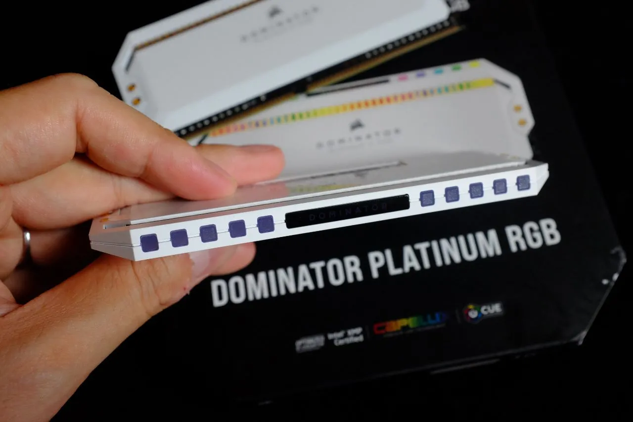alt text: Corsair Dominator Platinum RGB White Edition RAM installed in a motherboard, demonstrating its compatibility with RGB ecosystems.