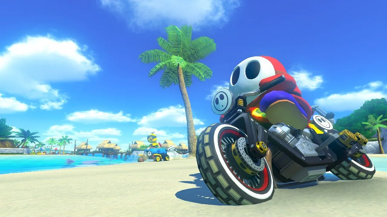 alt text describing image of Mario Kart 8 gameplay showing karts racing on a wall using anti-gravity