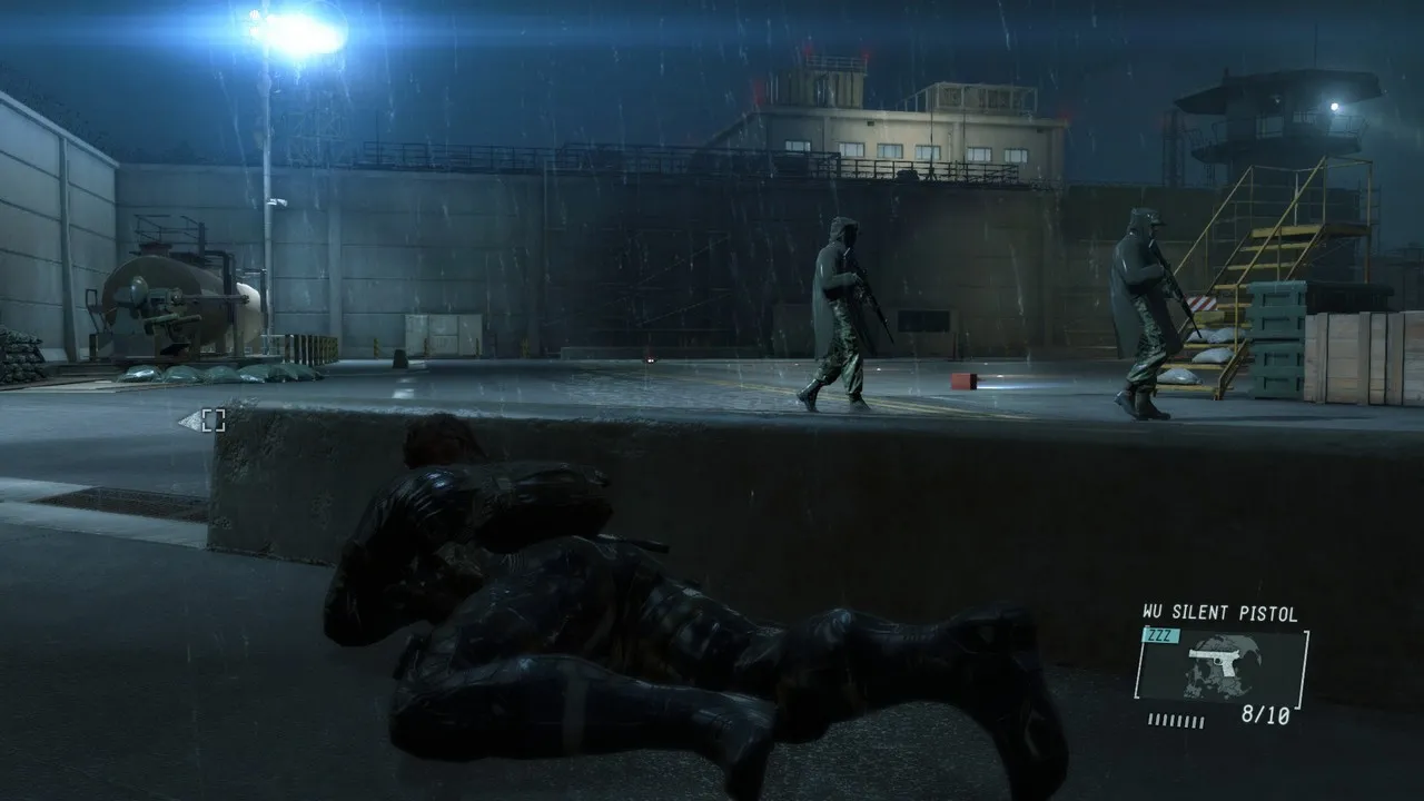 alt text: Snake crouching behind cover in Ground Zeroes.