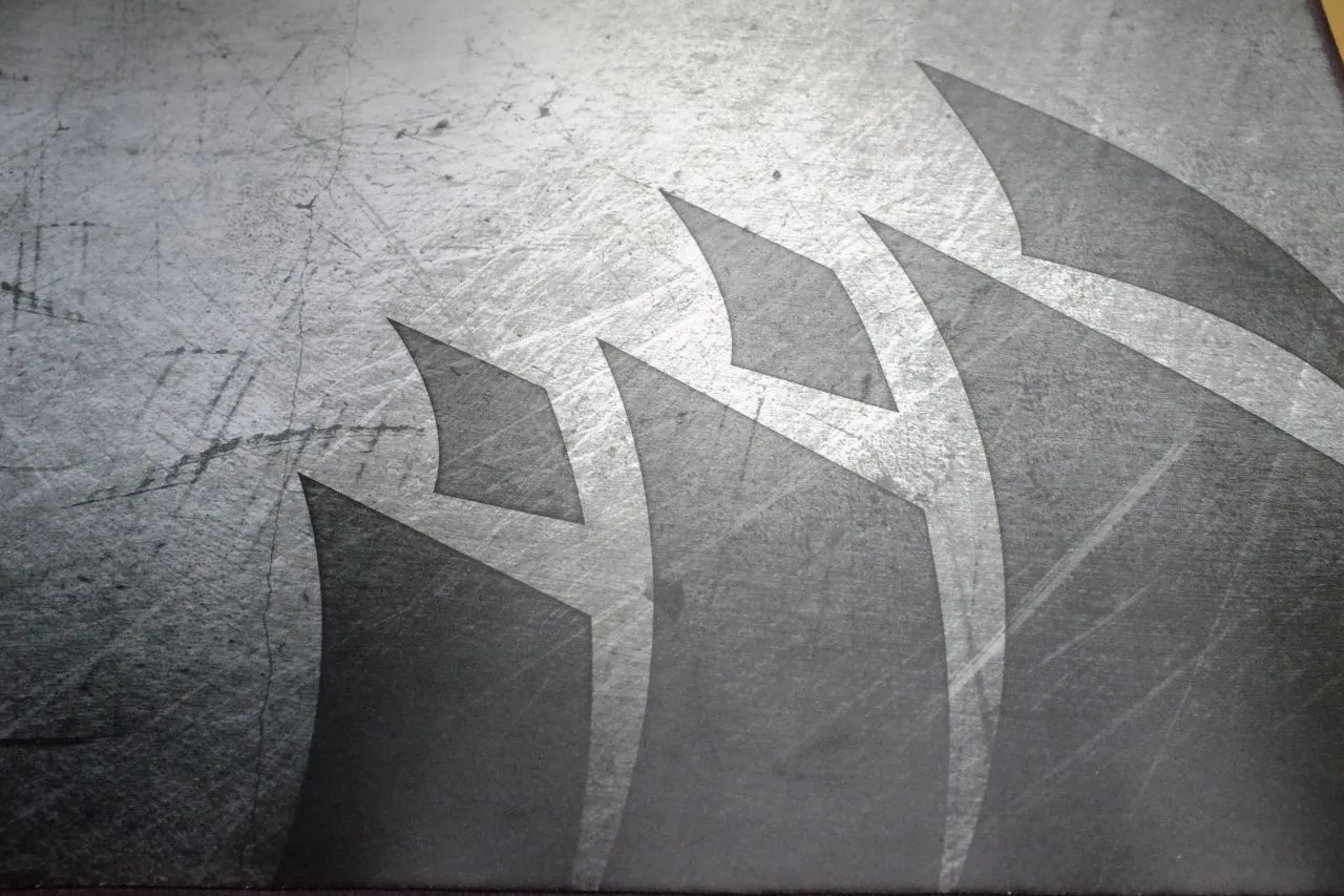 Demonstrating the spill-resistant coating of the Corsair MM350 Pro.