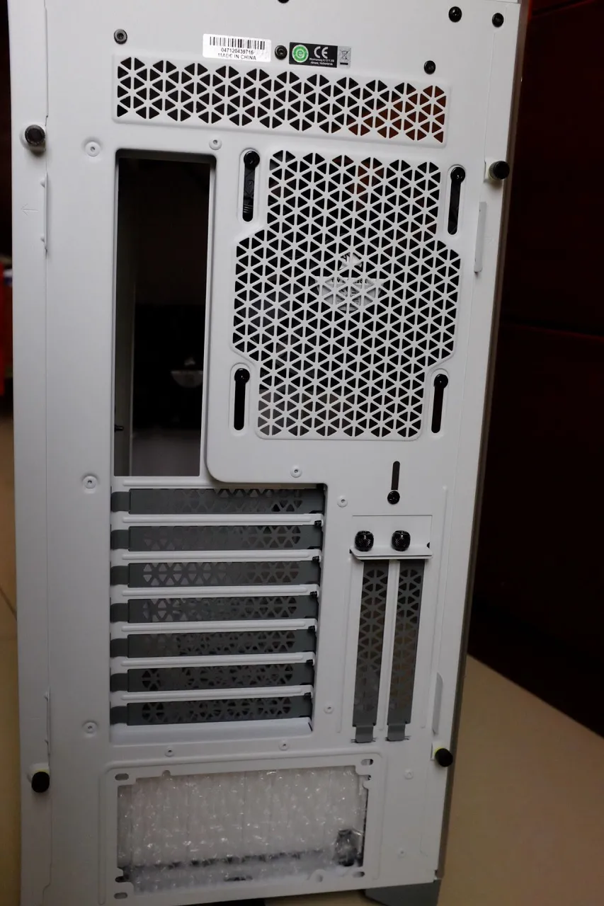 Rear view of the Corsair 5000D Tempered Glass Case showcasing the PCI-E slots and cable management options.