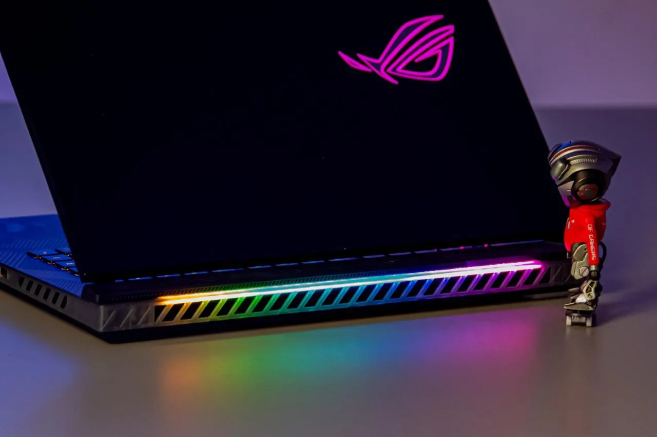 ROG Strix SCAR 18 open, showcasing keyboard and screen.