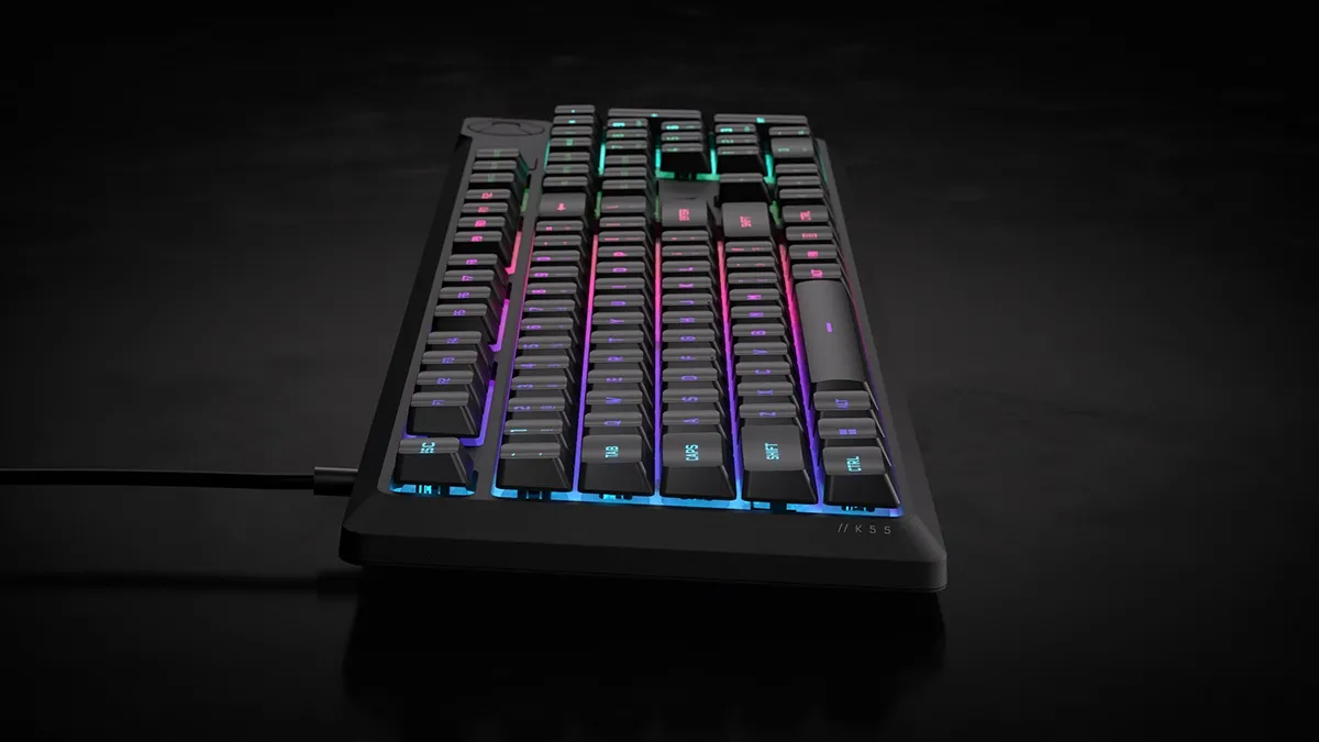 The CORSAIR K55 CORE gaming keyboard with highlighted media keys and Windows lock key.